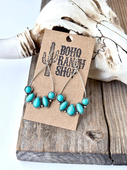 Turquoise teardrop hoop drop earrings with silver-tone western detailing and multiple turquoise-look stones