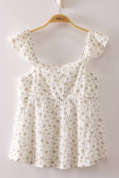 Blushing Prairie floral babydoll top available in blush and white with ruffle flutter sleeves and feminine tie-front neckline.