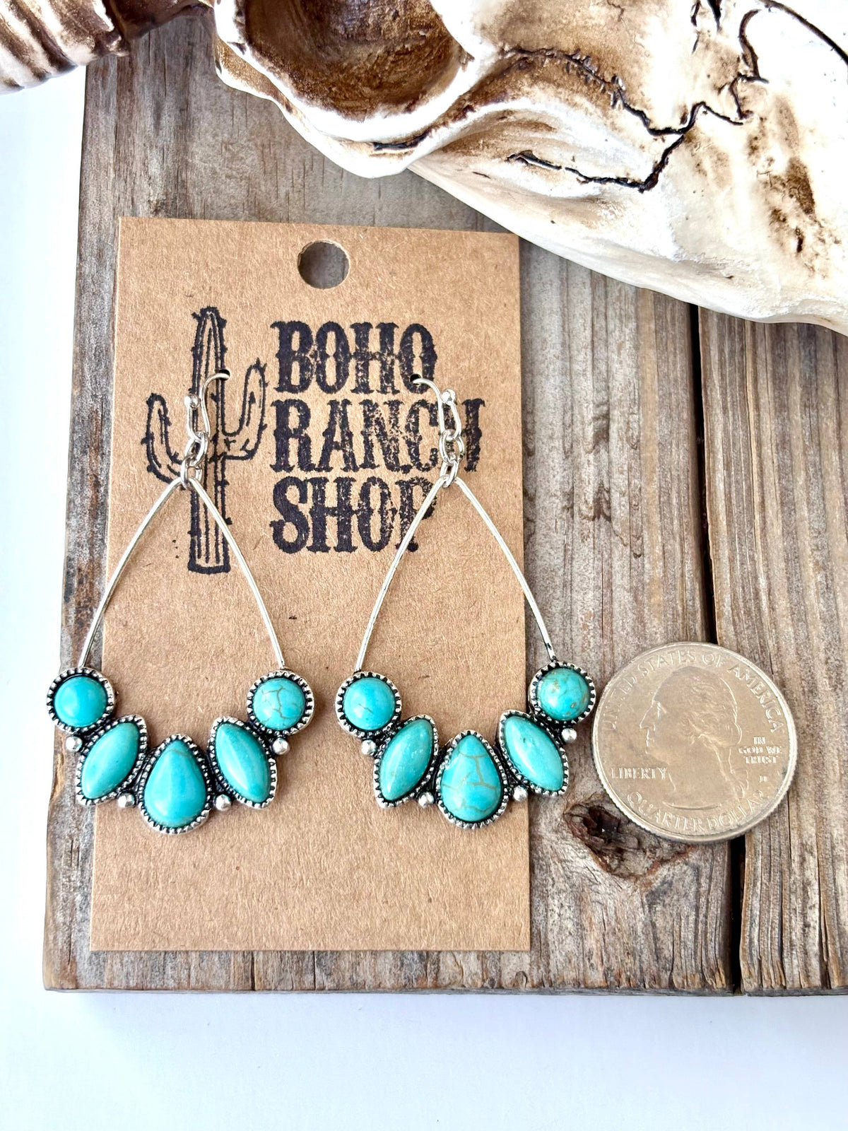 Turquoise teardrop hoop drop earrings with silver-tone western detailing and multiple turquoise-look stones