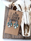 Black and white checkered western drop earrings with turquoise and iridescent stone accents displayed on a rustic wooden heart tray