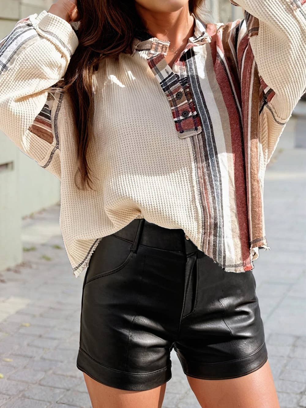 Rustic stripe mix waffle knit patchwork henley with button-up front and patchwork waffle knit design, styled with jeans.
